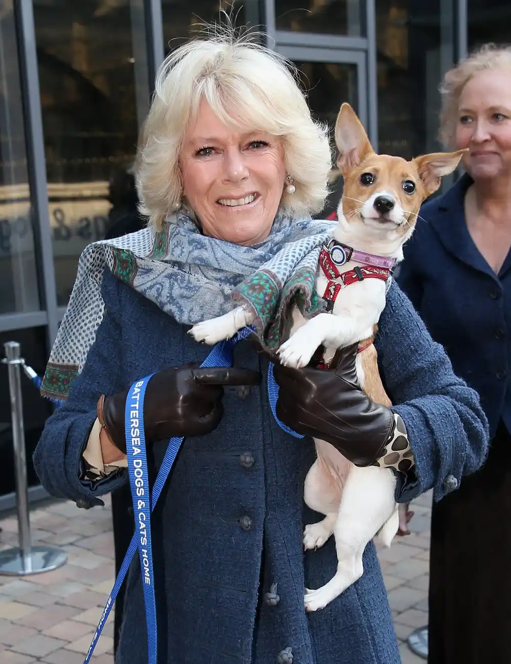 Queen Camilla holds her rescue dog