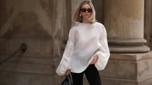 woman in white top and black pants