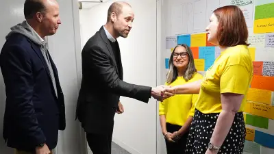 Prince William shakes a woman's hand