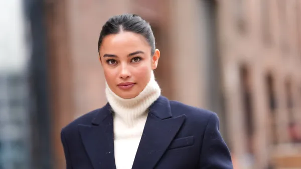 woman wearing white sweater and navy blazer