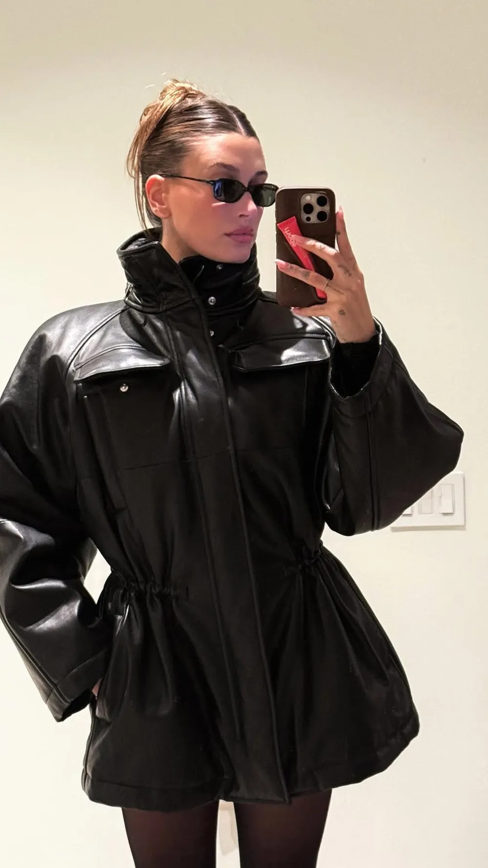 Hailey Bieber Wears Fit and Flare Leather Coat Dress on Date Night With Justin