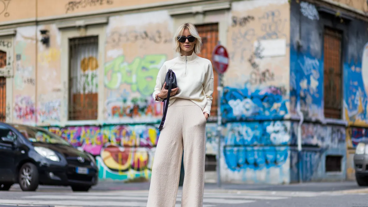 MILAN, ITALY - SEPTEMBER 22: Lisa Hahnbeuck (@lisarvd) wearing an Athleisure Look, Reebock sweater, Knit Pants Molli, sunglasses Givenchy, Adiletten, Chanel Boy Bag outside Fendi during Milan Fashion Week Spring/Summer 2017 on September 22, 2016 in Milan, Italy. (Photo by Christian Vierig/Getty Images)