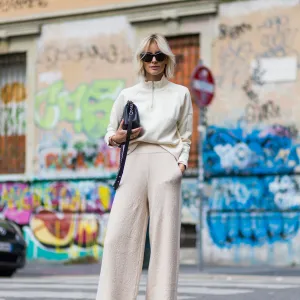 MILAN, ITALY - SEPTEMBER 22: Lisa Hahnbeuck (@lisarvd) wearing an Athleisure Look, Reebock sweater, Knit Pants Molli, sunglasses Givenchy, Adiletten, Chanel Boy Bag outside Fendi during Milan Fashion Week Spring/Summer 2017 on September 22, 2016 in Milan, Italy. (Photo by Christian Vierig/Getty Images)