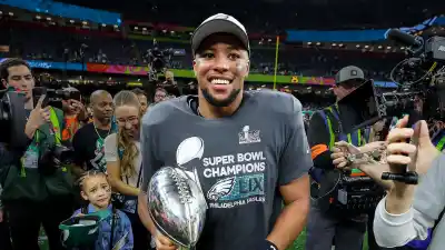 Shirtless Saquon Barkley Shotguns Beers in Locker Room After Super Bowl