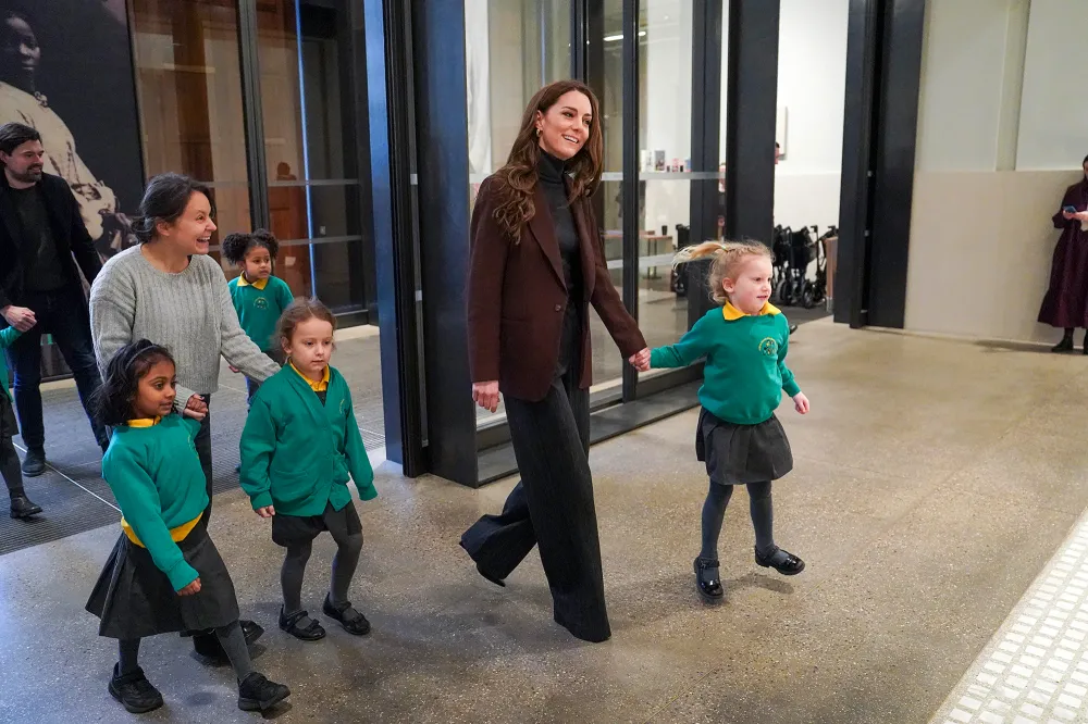 Kate Middleton Boards School Bus and Holds Hands With Children During Royal Visit