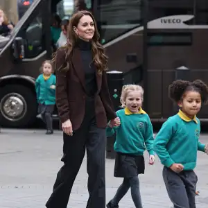 Kate Middleton Boards School Bus and Holds Hands With Children During Royal Visit