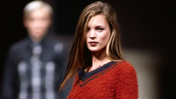 Kate Moss Modeling Martine Sitbon Skirt and Sweater (Photo by © Michel Arnaud/CORBIS/Corbis via Getty Images)