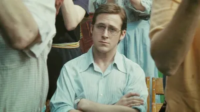 Ryan Gosling sits with his arms crossed in All Good Things.