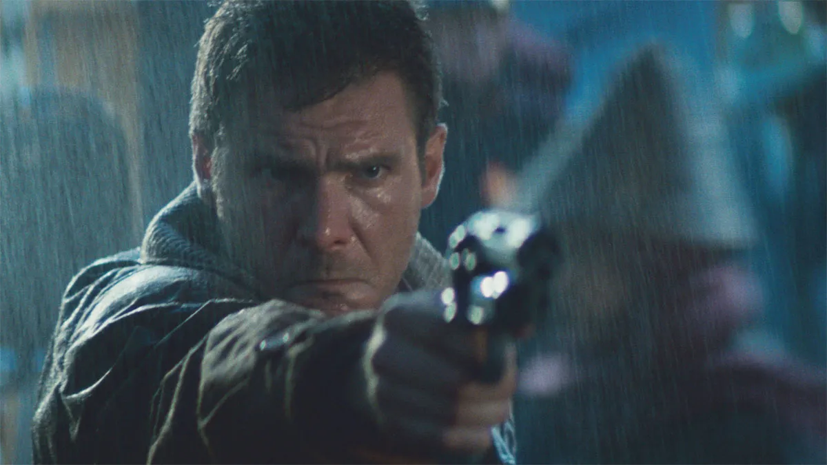 Harrison Ford aims a gun in Blade Runner.