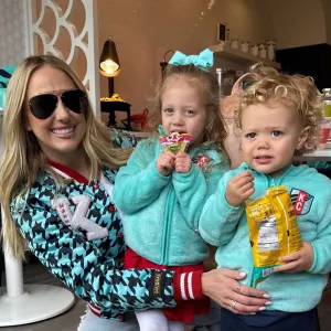 Brittany Mahomes Cuddles With Eldest Kids Sterling and Bronze at KC Current Soccer Game feature