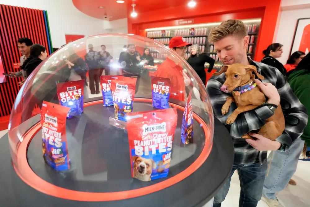 Kyle Cooke and Ryder attend the Milk-Bone x JIF Colab Collection Pop Up on Friday, March 28, 2025 in New York. (Charles Sykes/AP Content Services for Milk-Bone Peanut Buttery Bites)