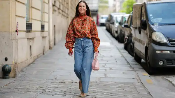woman in jeans and floral top