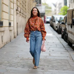 woman in jeans and floral top