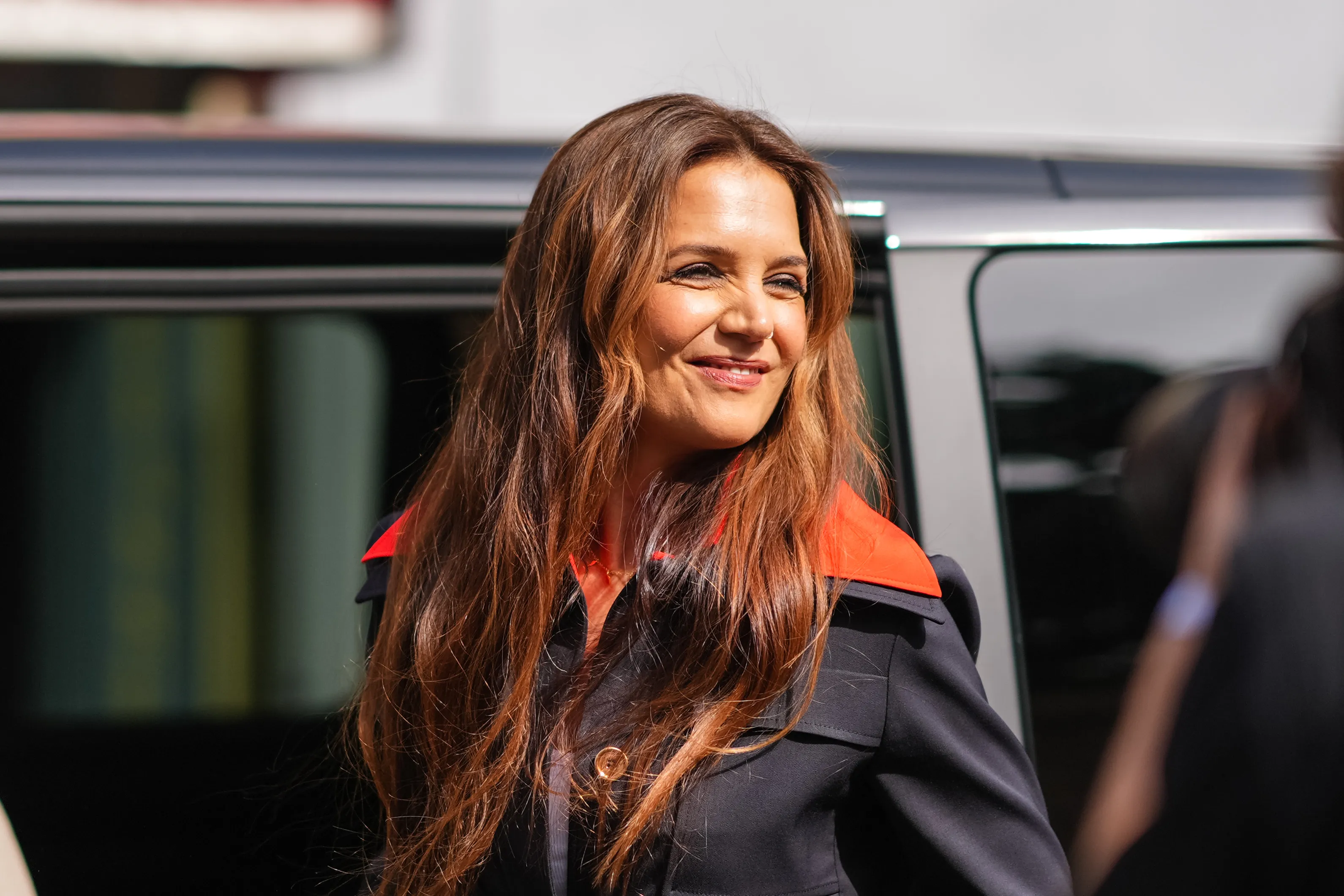 Katie Holmes wearing navy jacket