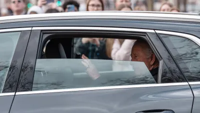 King Charles in a car