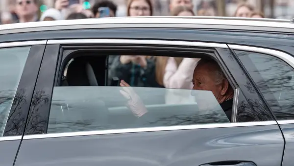 King Charles in a car
