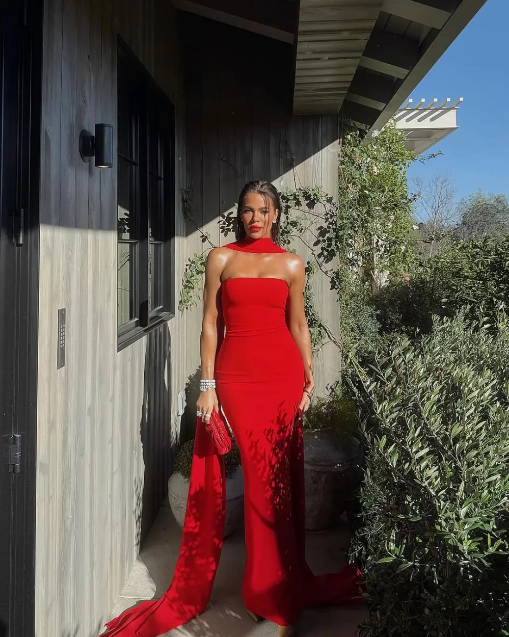 Khloe Kardashian Has Bombshell Moment in Cherry Red Look