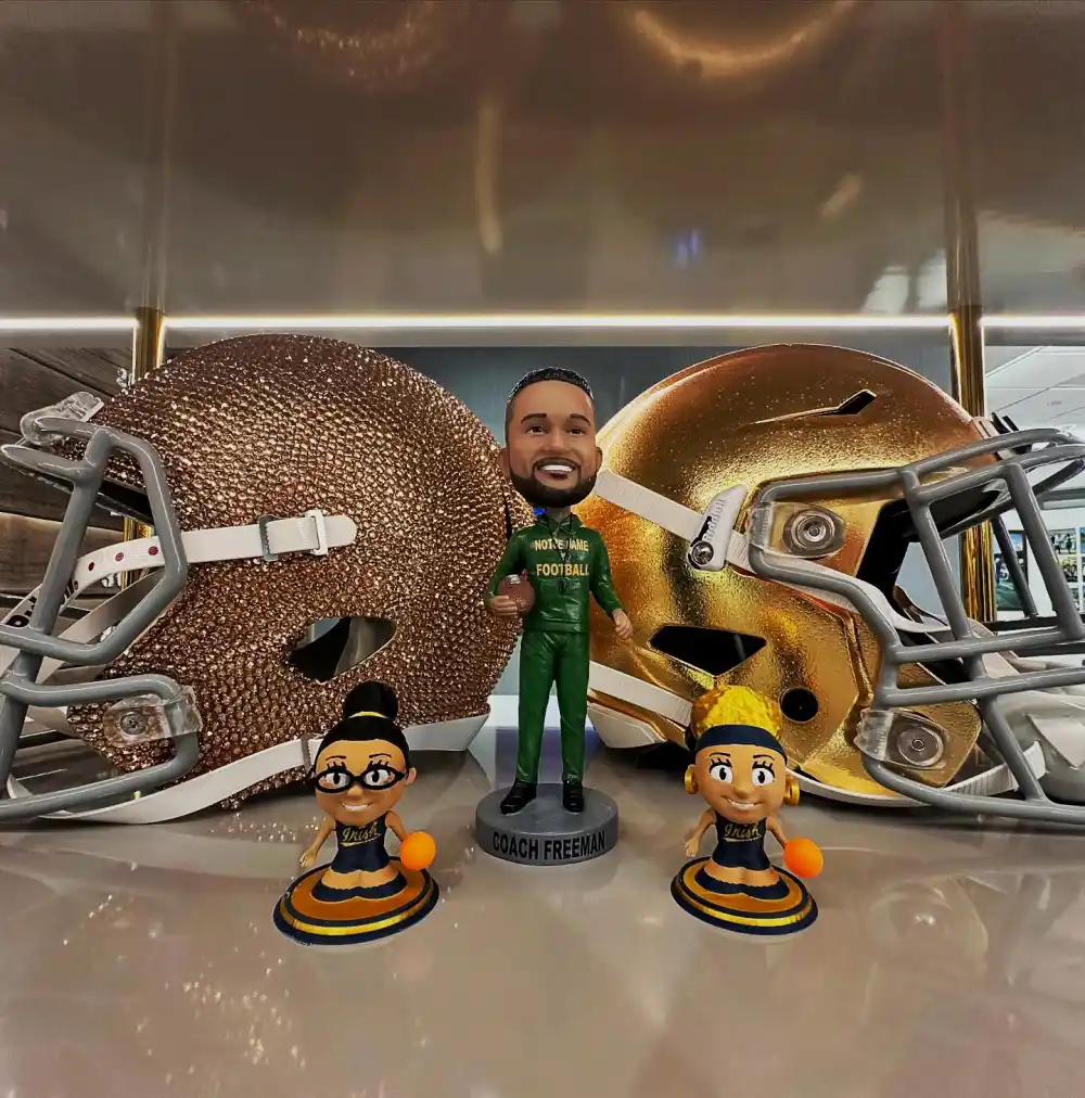 Notre Dame Head Coach Marcus Freeman Shows Off His Bobblehead &mdash; With Very Accurate Hairline 964