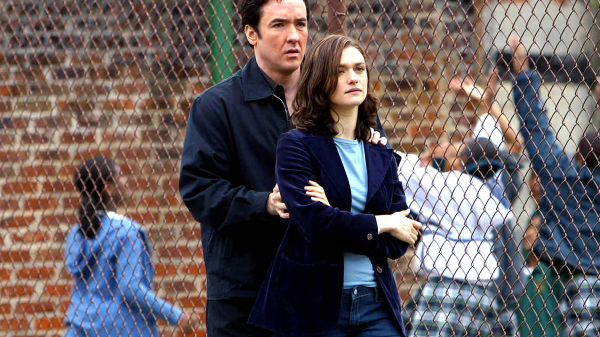 John Cusack and Rachel Weisz comfort each other in Runaway Jury.