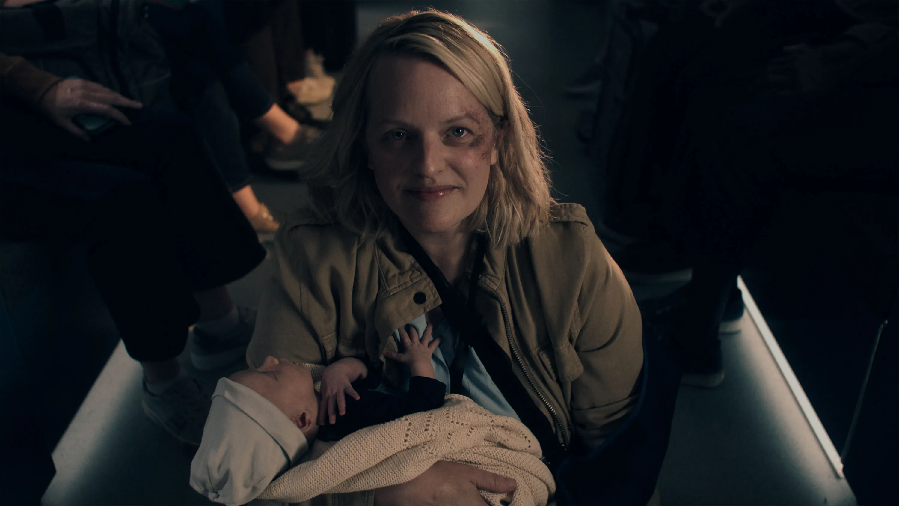 Elizabeth Moss holds a baby in The Handmaid's Tale Season 6.