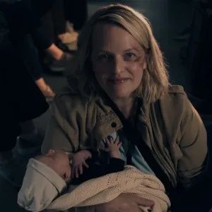 Elizabeth Moss holds a baby in The Handmaid's Tale Season 6.