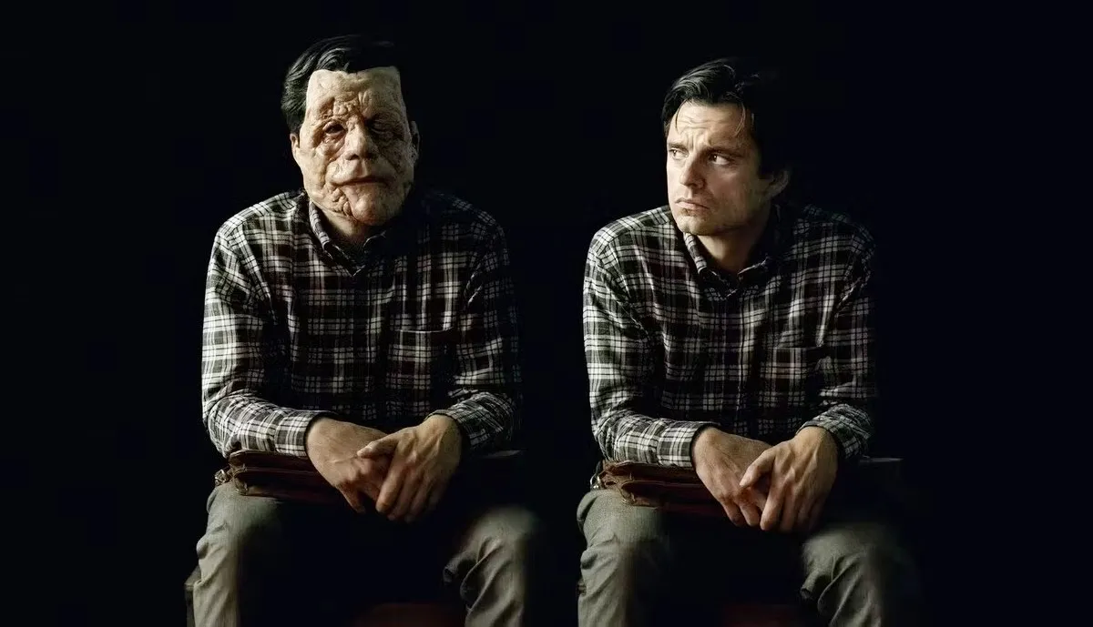 Two men sit in A Different Man.