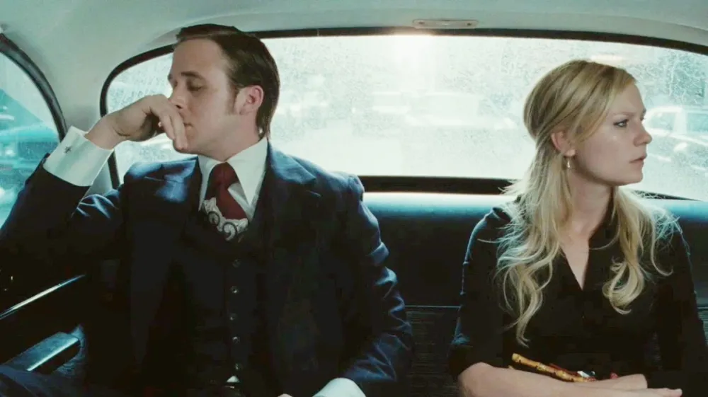 Ryan Gosling and Kirsten Dunst ride in a car together in All Good Things.