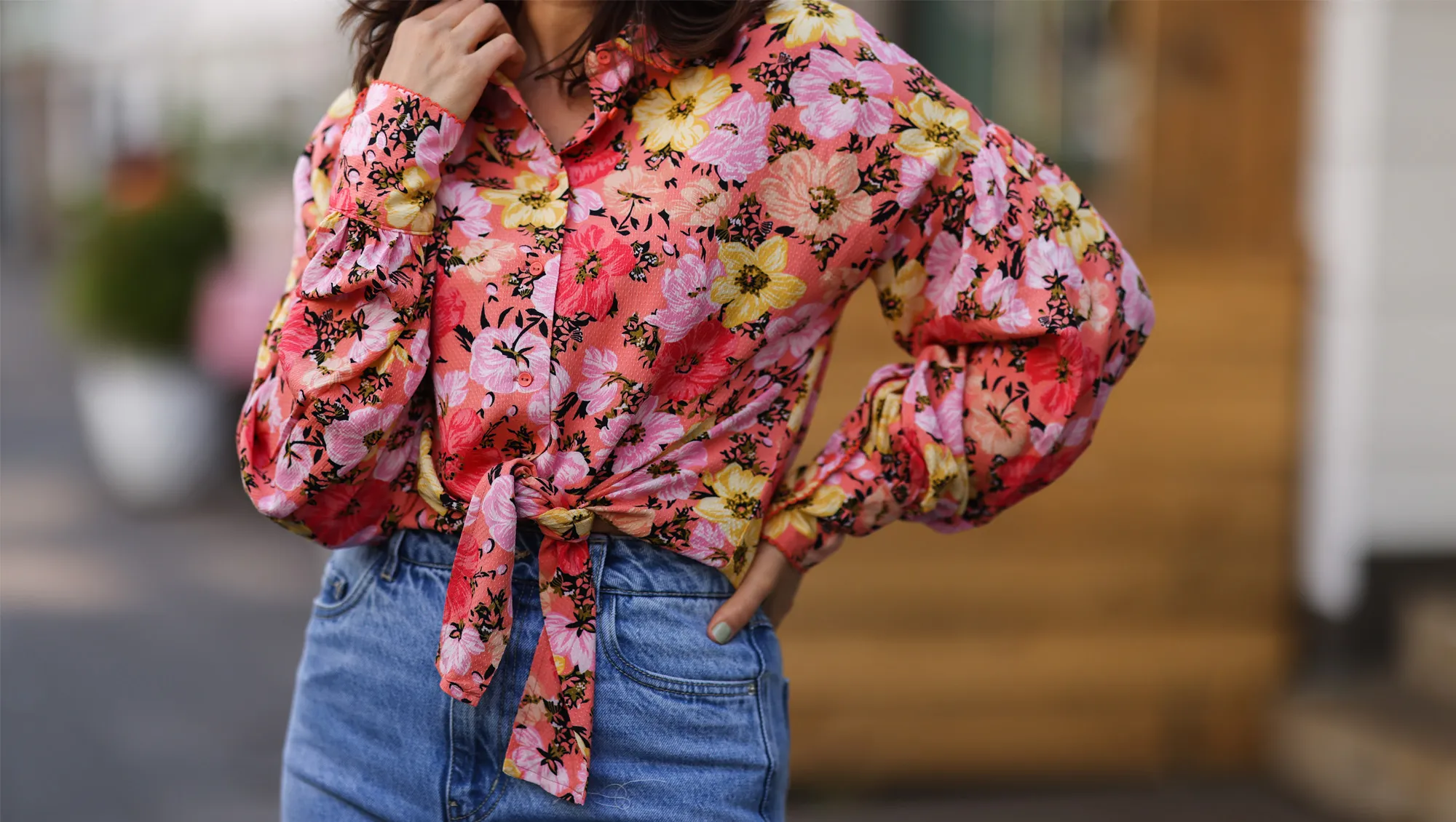 Anna Wolfers wearing colorful floral blouse and blue jeans on May 01, 2021 in Hamburg, Germany.