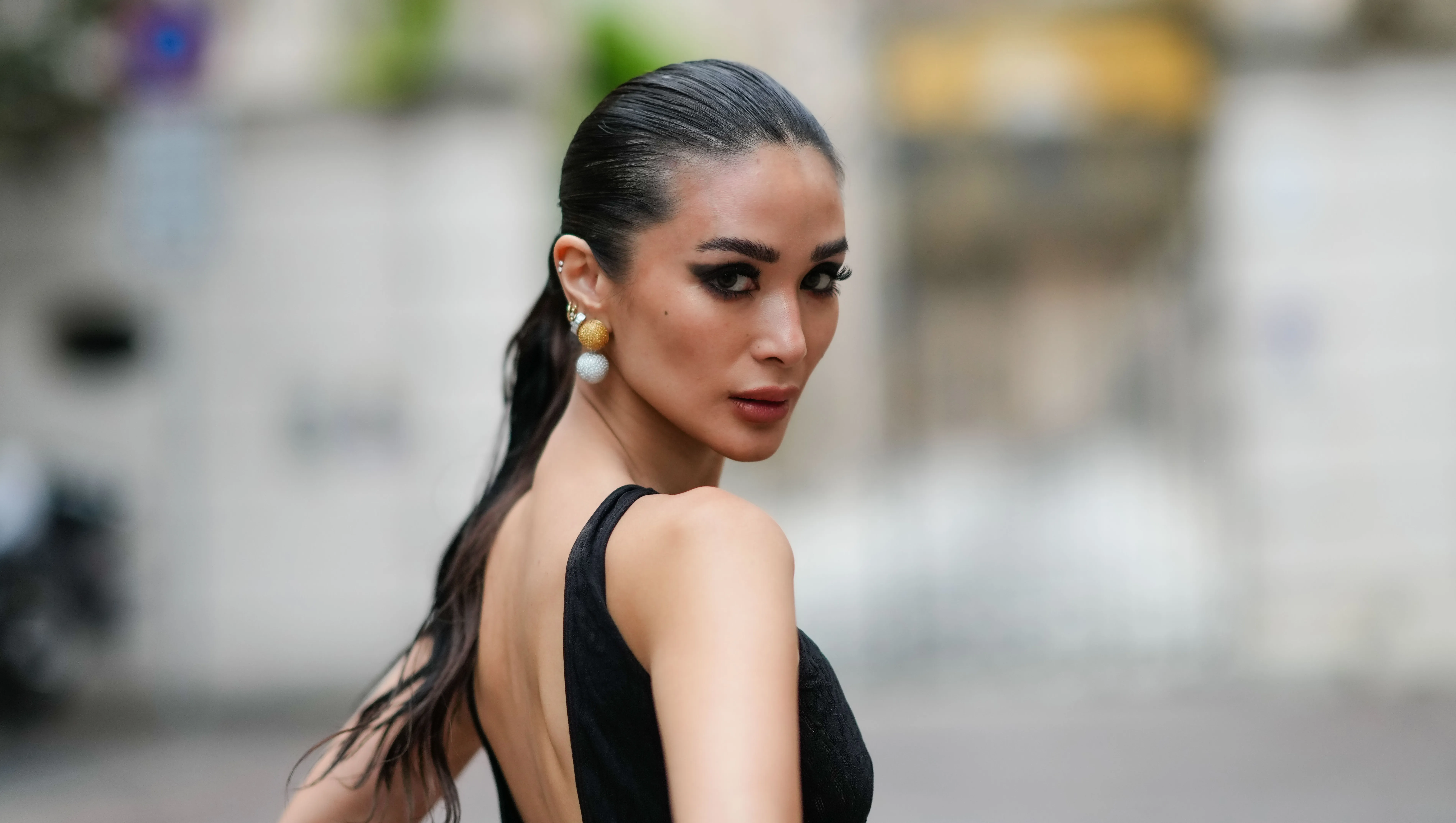 MILAN, ITALY - SEPTEMBER 20: Heart Evangelista wears a sleeveless black long mesh bodysuit with fluffy pants and floral embroidery, outside Roberto Cavalli, during the Milan Fashion Week - Womenswear Spring/Summer 2024 on September 20, 2023 in Milan, Italy. (Photo by Edward Berthelot/Getty Images)