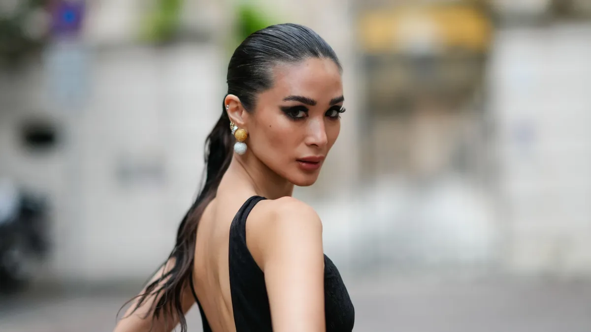 MILAN, ITALY - SEPTEMBER 20: Heart Evangelista wears a sleeveless black long mesh bodysuit with fluffy pants and floral embroidery, outside Roberto Cavalli, during the Milan Fashion Week - Womenswear Spring/Summer 2024 on September 20, 2023 in Milan, Italy. (Photo by Edward Berthelot/Getty Images)
