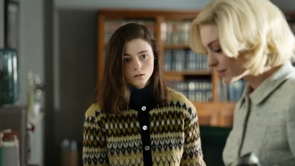 A girl looks at a woman in Eileen.