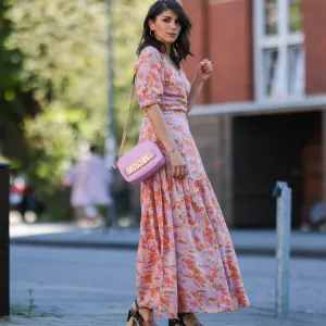 woman wearing floral pink maxi dress