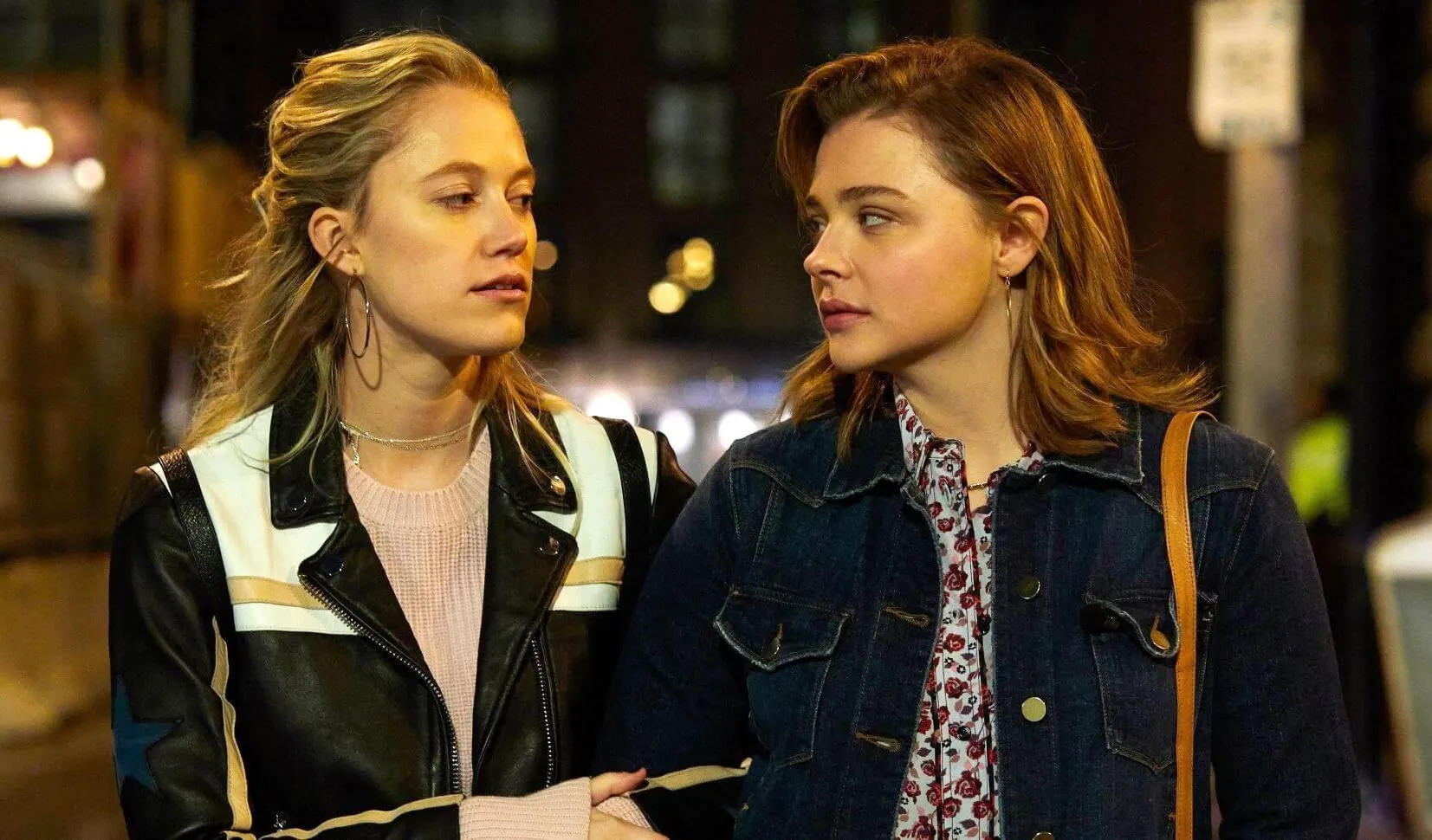 Two women look at each other in Greta.