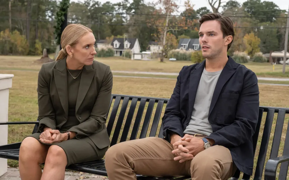 A man and a woman sit on a bench in Juror #2.