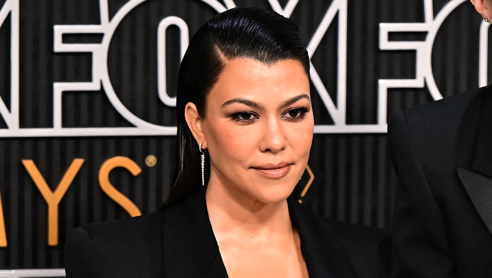 US socialite Kourtney Kardashian and husband US musician Travis Barker arrive for the 75th Emmy Awards at the Peacock Theatre at L.A. Live in Los Angeles on January 15, 2024. (Photo by Frederic J. Brown / AFP) (Photo by FREDERIC J. BROWN/AFP via Getty Images)