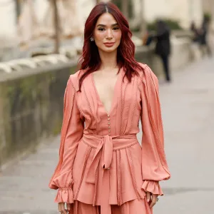 PARIS, FRANCE - JANUARY 29: Heart Evangelista wears a peach blouse with matching maxi skirt, crystal decorated bag, outside Elie Saab, during the Haute Couture Spring-Summer 2025 as part of Paris Fashion Week on January 29, 2025 in Paris, France. (Photo by Claudio Lavenia/Getty Images)