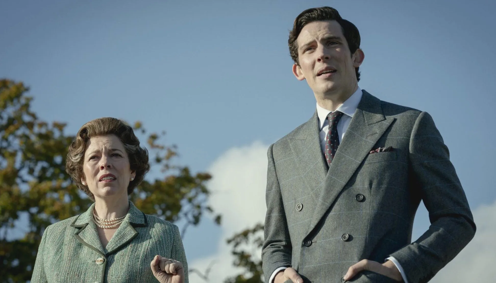 Prince Charles and Queen Elizabeth II stand outside in The Crown.