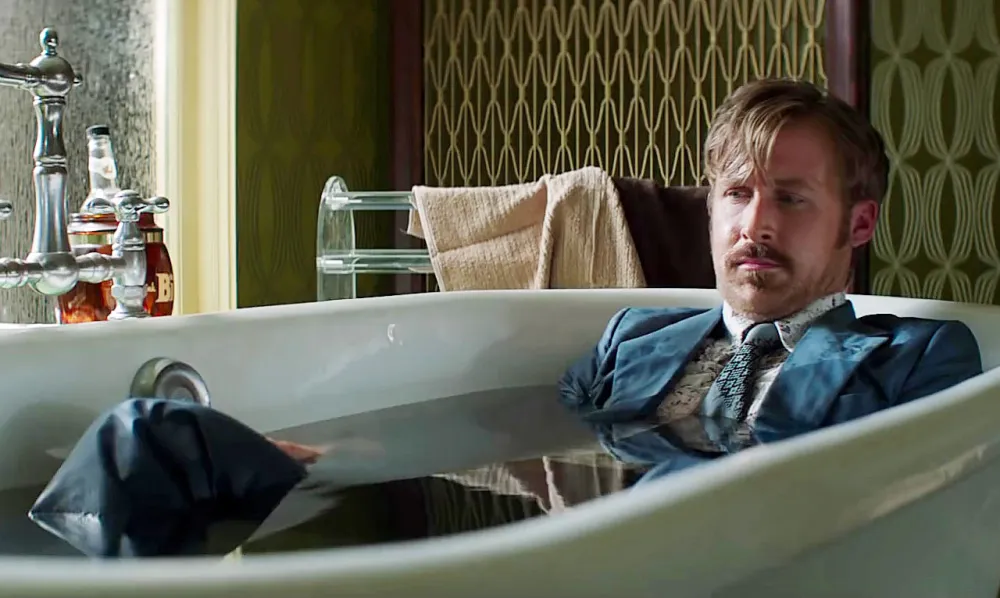 A man sits in a tub in The Nice Guys.