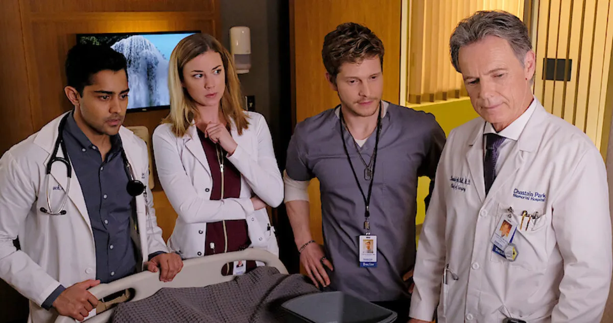 Four doctors stand near a patient's bed in The Resident.
