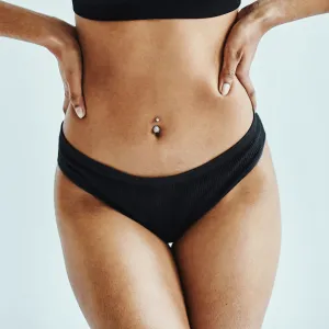 Happy, woman and lingerie in a studio for wellness, beauty and weight loss against a white background mockup. Health, black woman and underwear model posing, laughing and feeling confident mock up