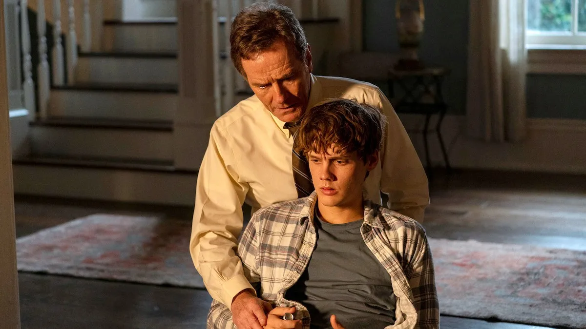 A man stands over a boy tied to a chair in 'Your Honor.'