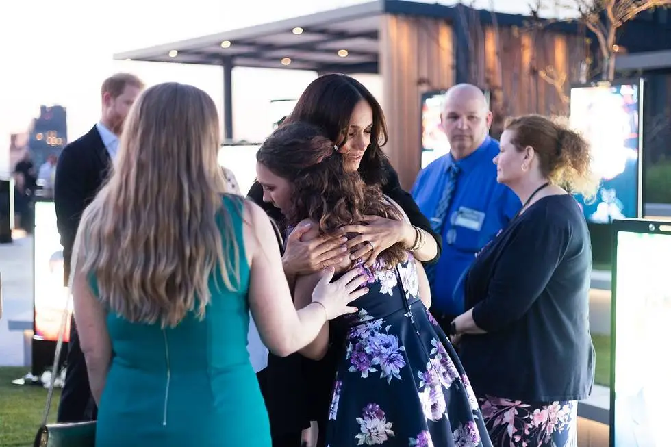 Meghan Markle hugging an unnamed women at the NYC memorial installation