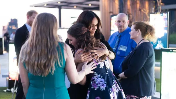 Meghan Markle hugging an unnamed women at the NYC memorial installation