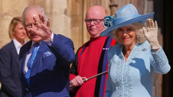 WINDSOR, ENGLAND - APRIL 20: Britain's King Charles III and Queen Camilla wave at the crowd as they arrive for the Easter Matins Service at St. George's Chapel, Windsor Castle on April 20, 2025 in Windsor, England. (Photo by Kirsty Wigglesworth - WPA Pool/Getty Images)