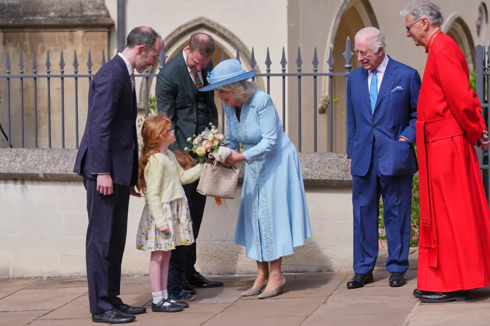 WINDSOR, ENGLAND - APRIL 20: Britain's King Charles III (2nd R), with Queen Camilla (C), who receives a posy, as they leave after attending the Easter Matins Service at St. George's Chapel, Windsor Castle on April 20, 2025 in Windsor, England. (Photo by Kirsty Wigglesworth - WPA Pool/Getty Images)