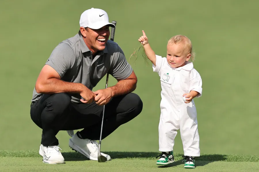 Cutest Kids at 2025 Masters Tournament Rory McIlroy s Daughter Poppy to Scottie Scheffler s Son Bennett 569 Brooks Koepka of the United States watches his child Crew