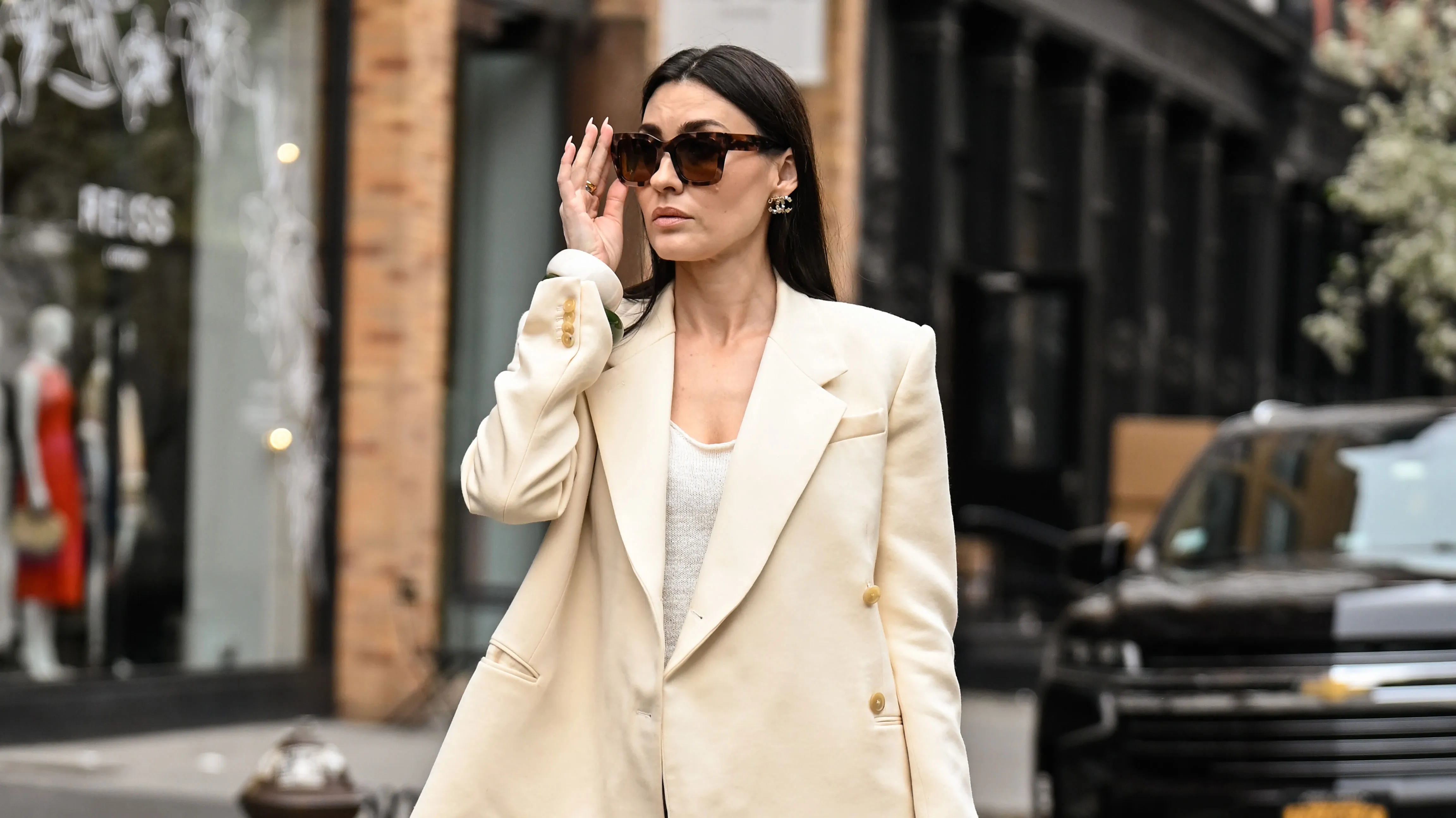 NEW YORK, NEW YORK - APRIL 15: Yana Echko is seen wearing a Khaite blazer, Zara top, Dries Van Noten skirt, Chanel bag, Chanel earrings, Warby Parker sunglasses, KOZAKH rings, Lola and Rose rings and Zara bracelets on April 15, 2025 in New York City. (Photo by Daniel Zuchnik/Getty Images)