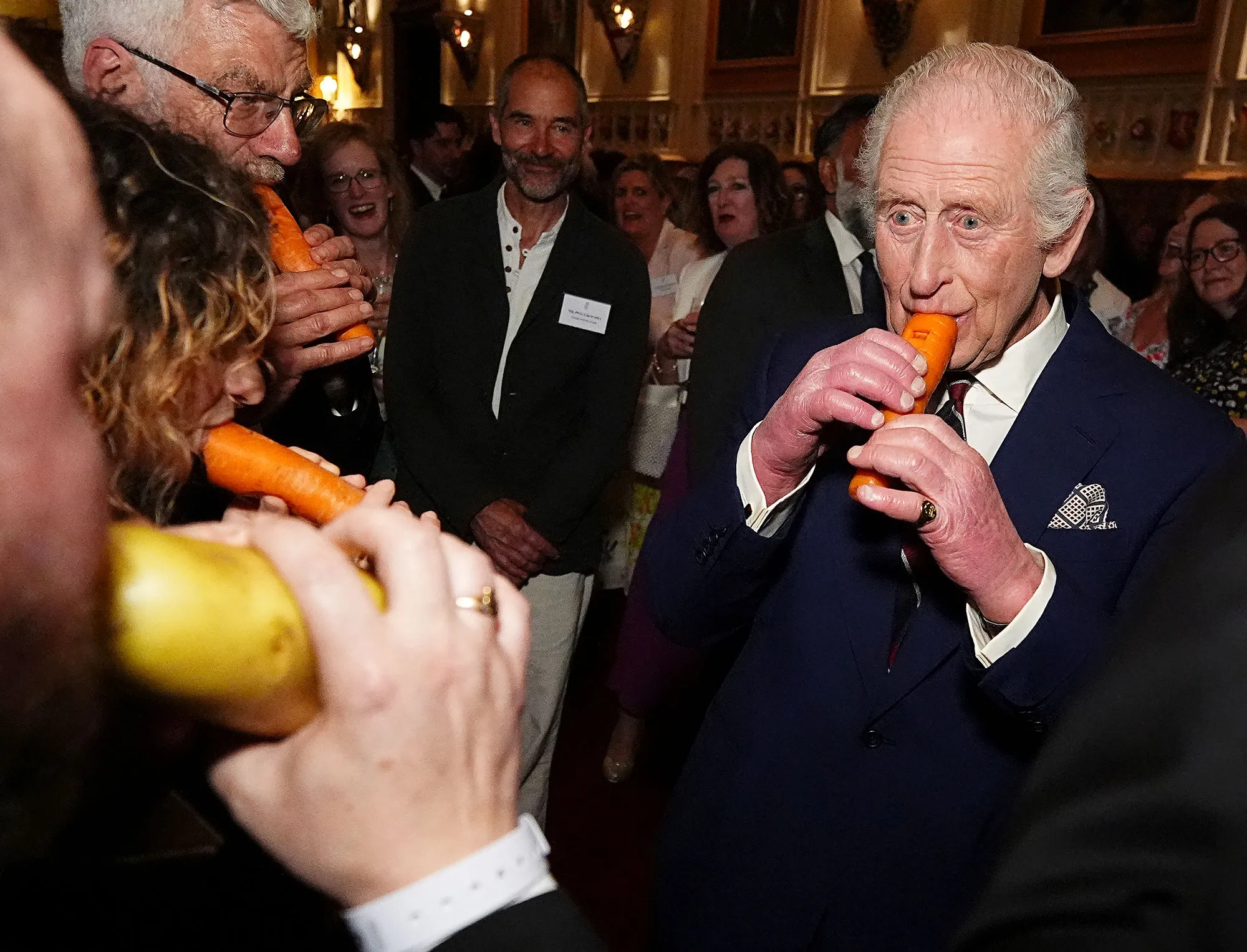Feature King Charles Plays a Carrot Instrument With London Vegetable Orchestra