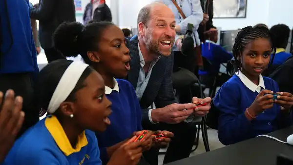 Prince William playing computer games with kids