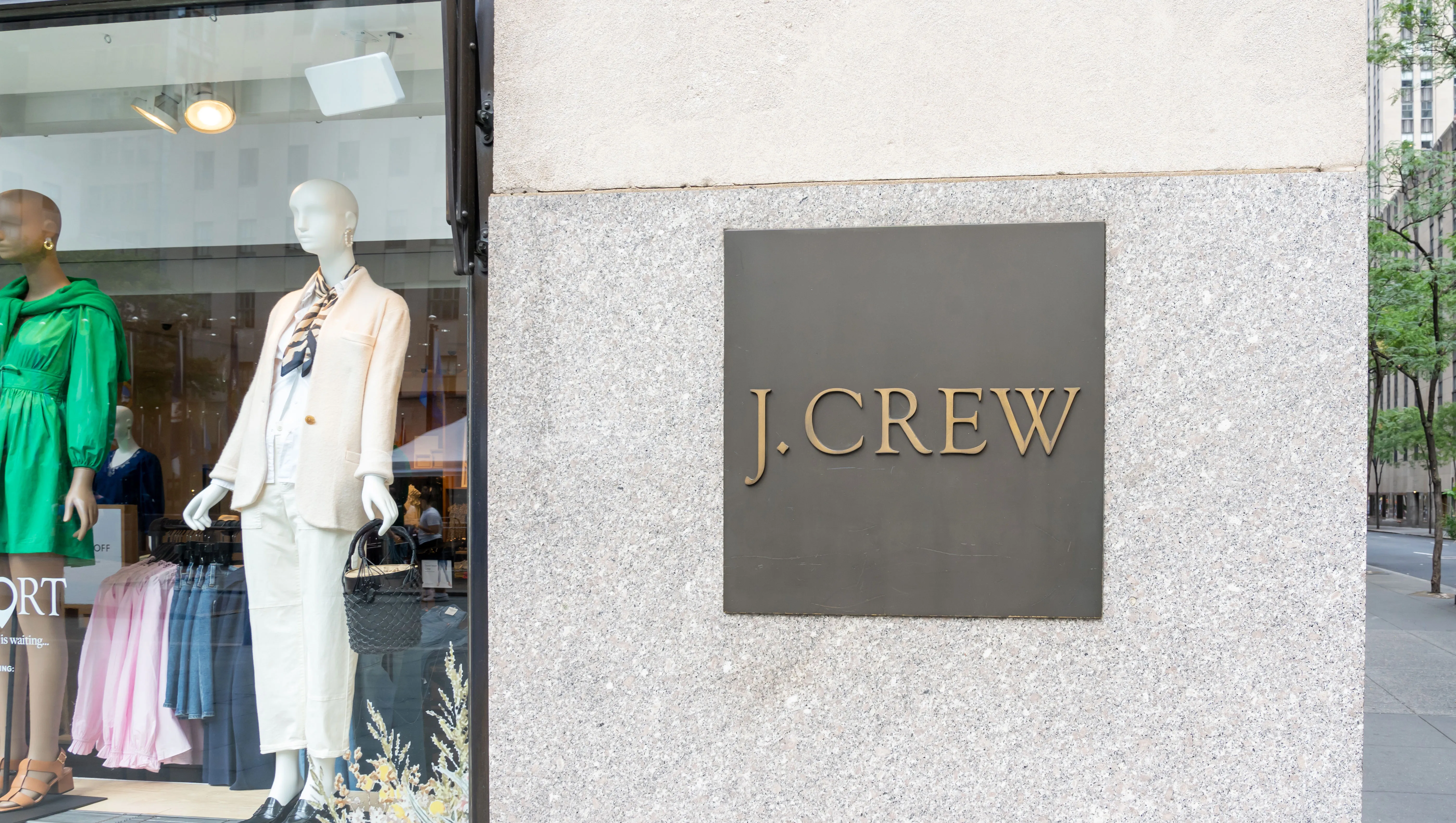 New York City, USA - August 21, 2022: A J.Crew store sign on the building is seen on Fifth Ave. in New York City, USA. J.Crew Group, Inc., is an American multi-brand, multi-channel, specialty retailer.